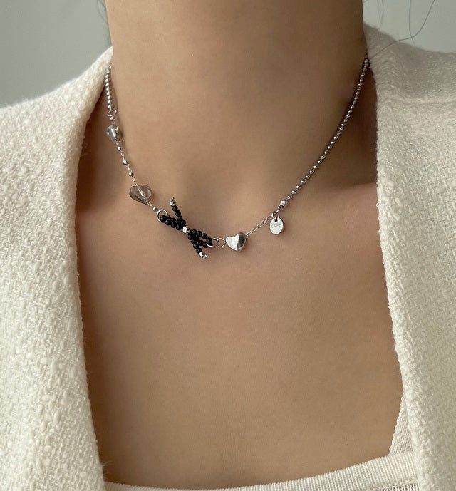 Acer rojo(アセルロジョ)の「bru Ballet Core Stainless Steel Titanium Ribbon Black Beads Heart Short Layered Necklace(Accessories)」