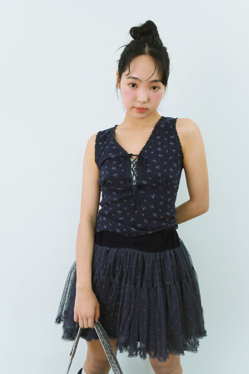 SHAKIRI（シャキリ）の「FLOWER EYELET LACE UP TOP（Tops）」