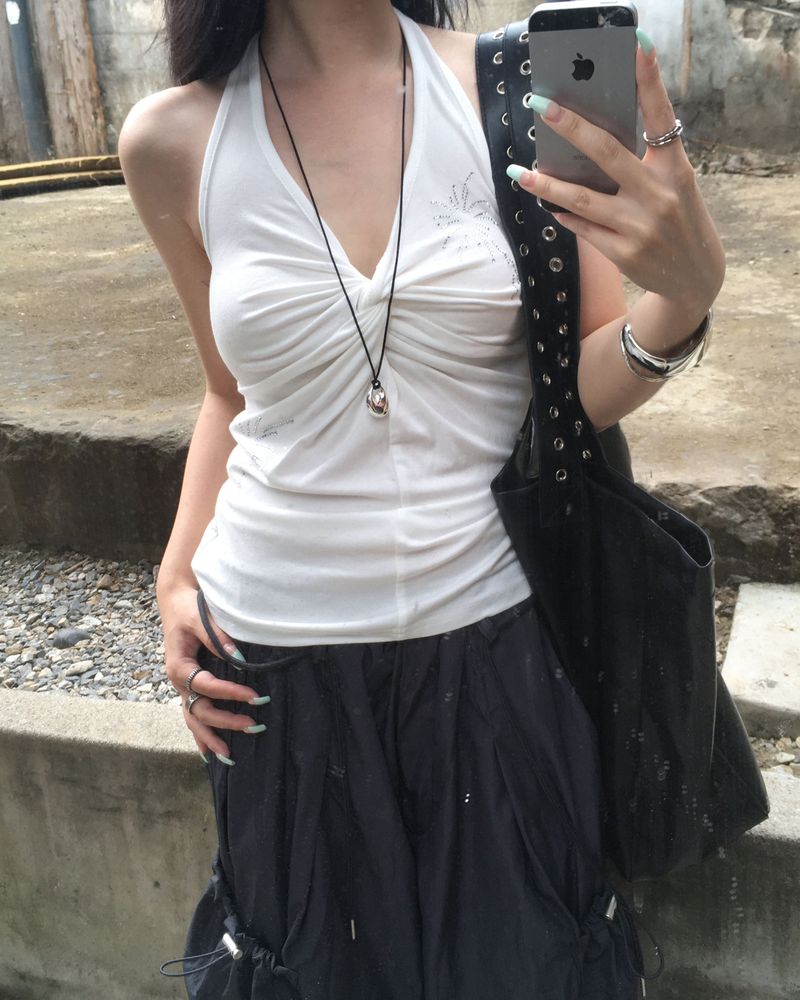 Cubic twisted sleeveless