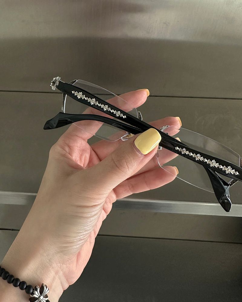 chrome cross-rimmed glasses