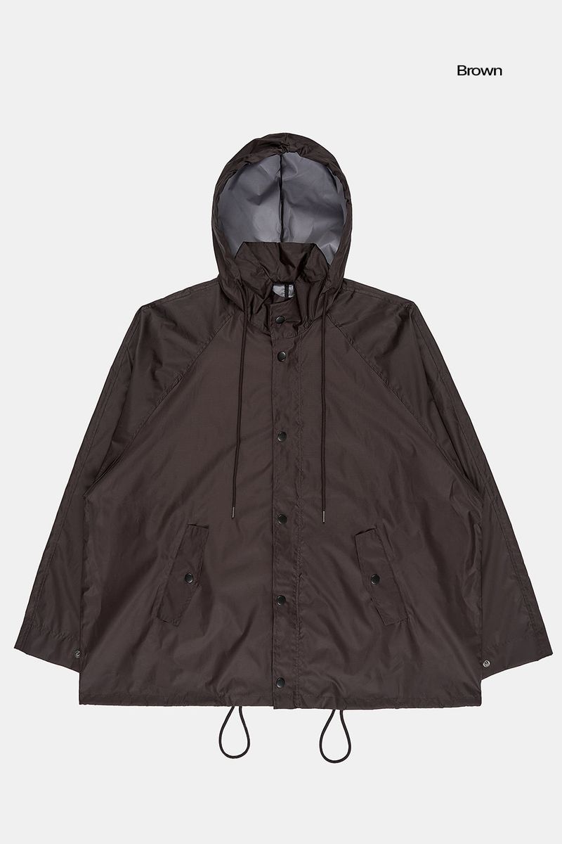 Fishtail raglan over raincoat