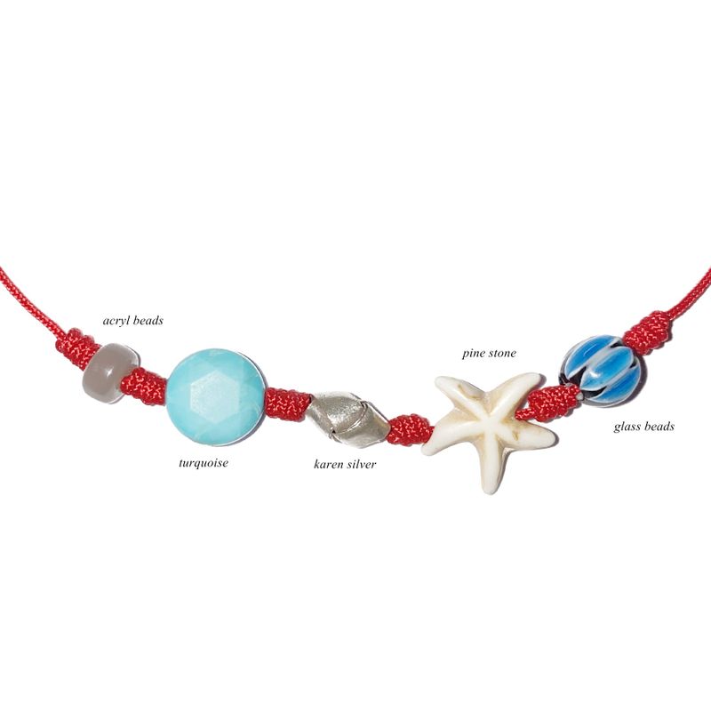 red gemstone necklace