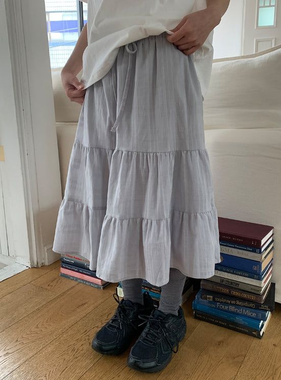 BAON（バオン）の「Saya Tiered Banding Midi Skirt（Skirts）」
