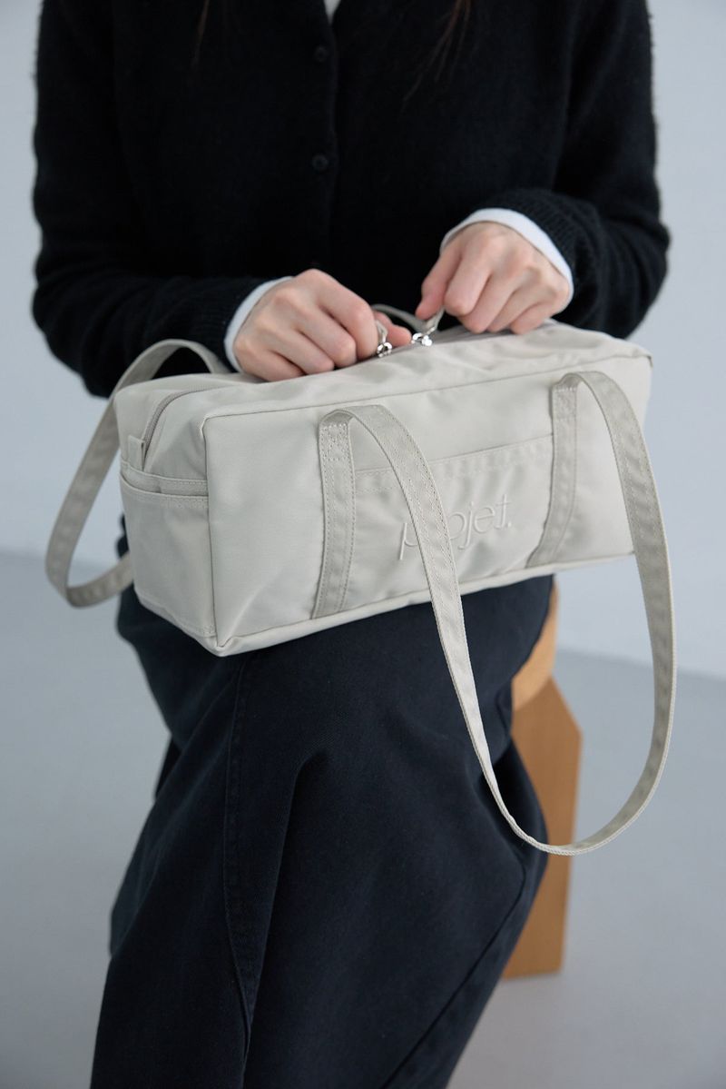 compact duffle bag (light beige)