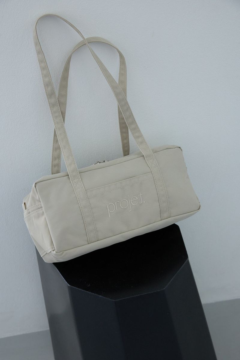 compact duffle bag (light beige)