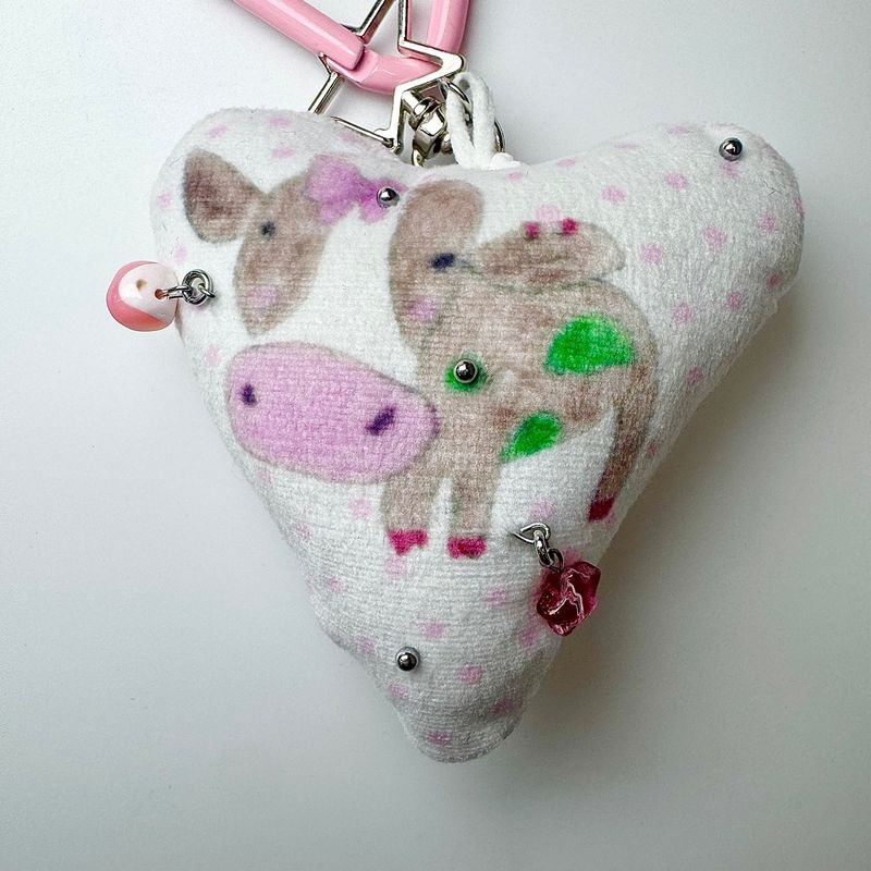 Pierced pinky cow keychain