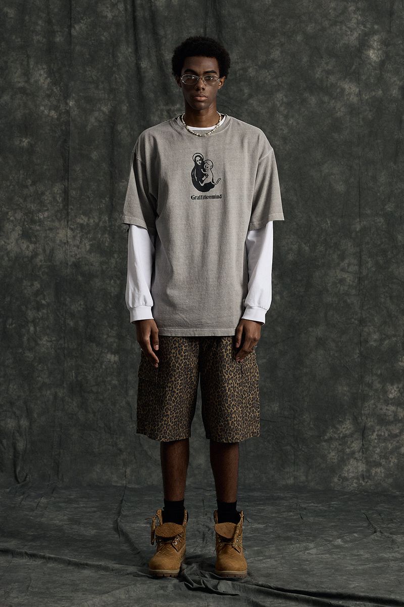 GRAFFITIONMIND（グラフィティオンマインド）の「Cat Pigment T-shirt (Grey)（Tops）」
