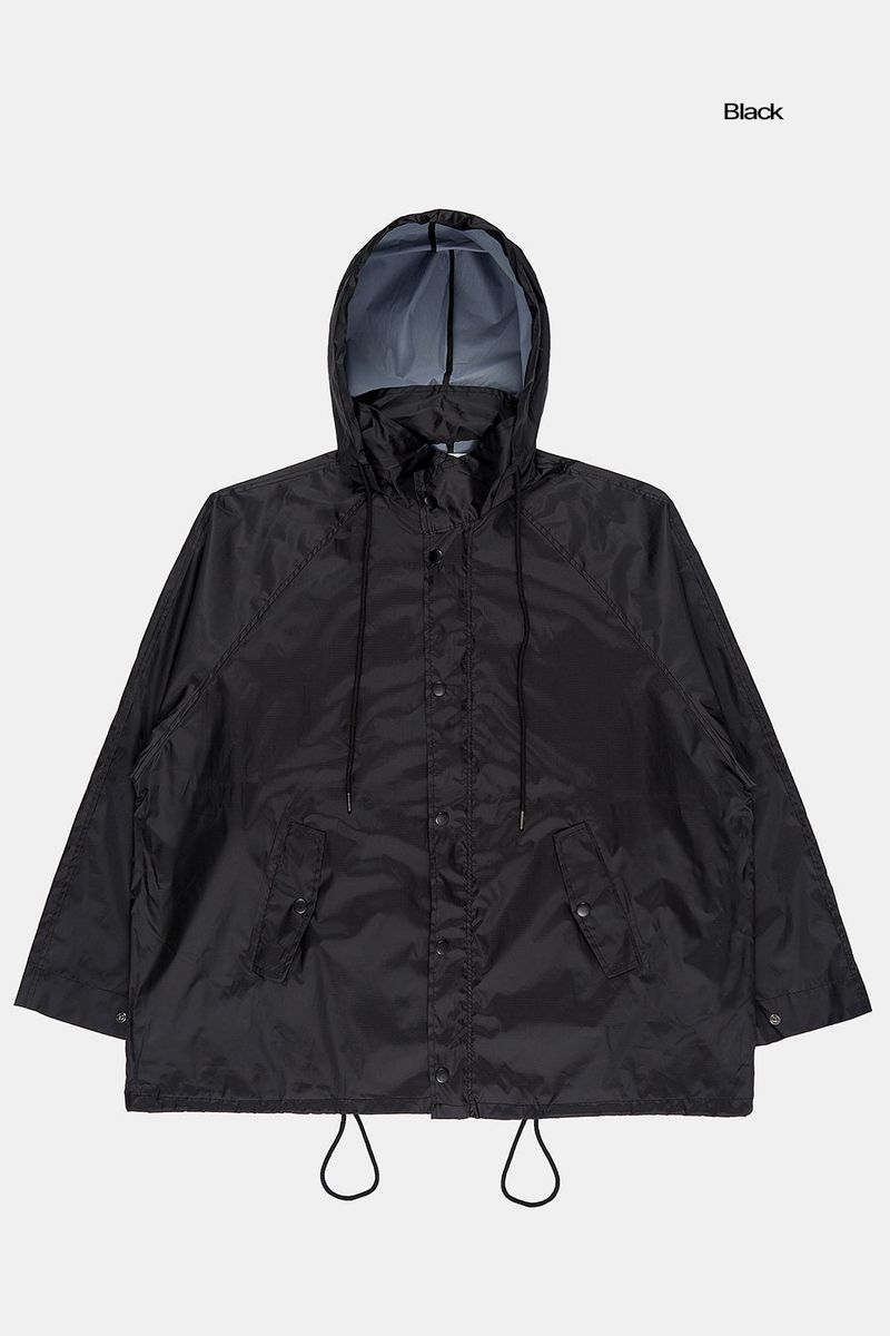Fishtail raglan over raincoat