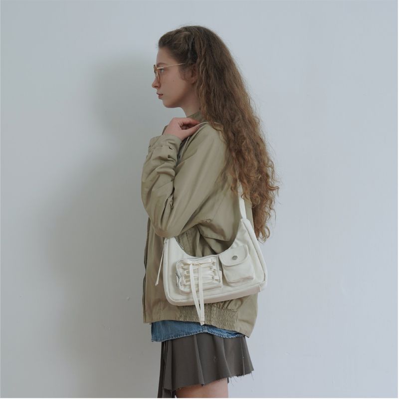 cozing(コジング)の「Ribbon hobo bag_ivory(Bags)」