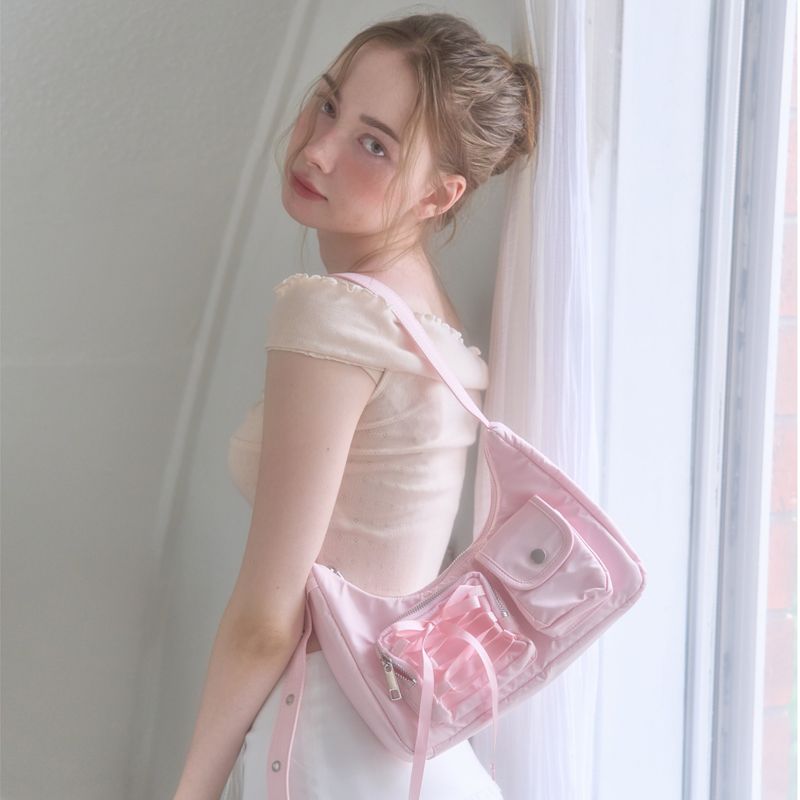 cozing（コジング）の「Nylon ribbon hobo bag_pink（Bags）」
