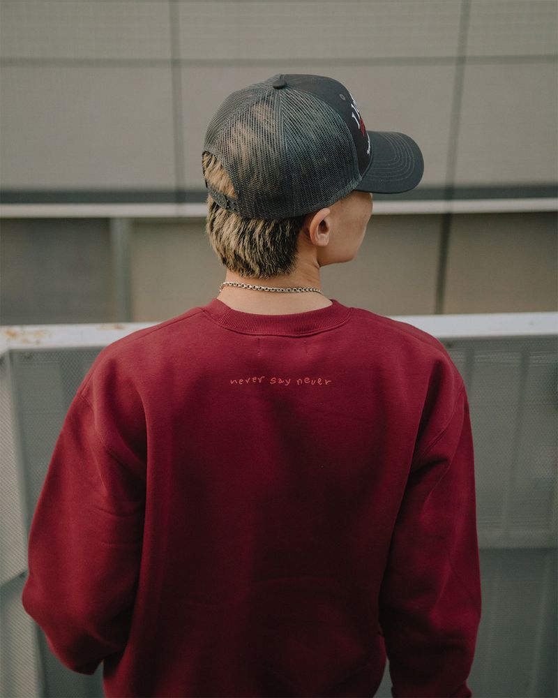 neversaynever®︎（ネバーセイネバー）の「NSN ロゴクルーネック レッド（Tops）」