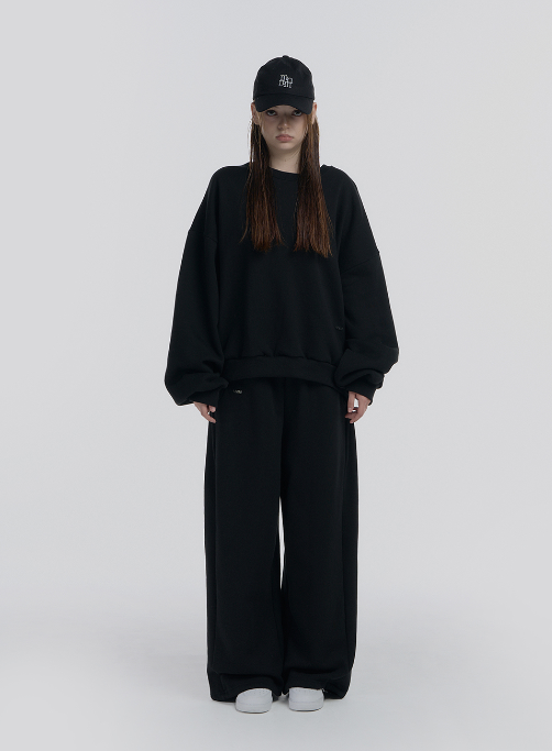 mnem（ムネム）の「[mnem] pintuck logo jogger pants (black)（Pants）」