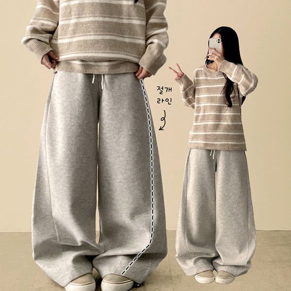 Mende Curved Incision Woolen Wide Pants