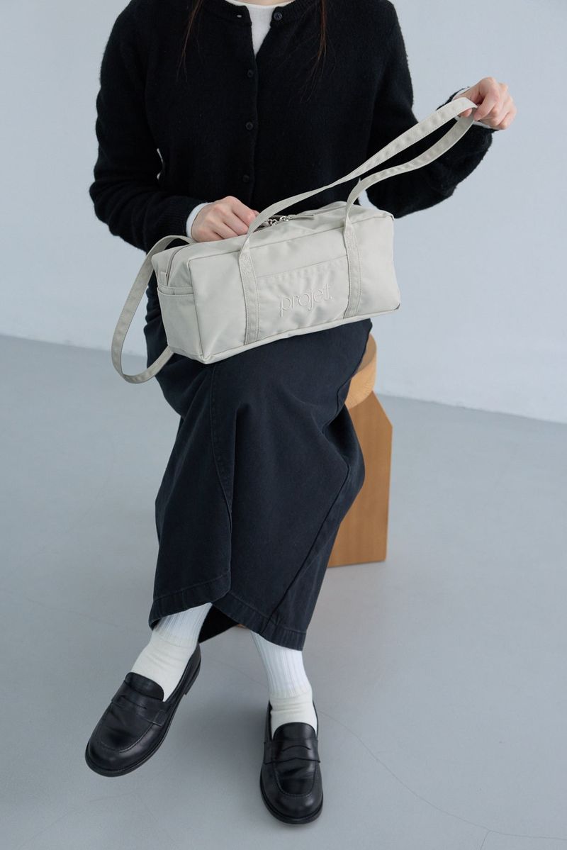 compact duffle bag (light beige)