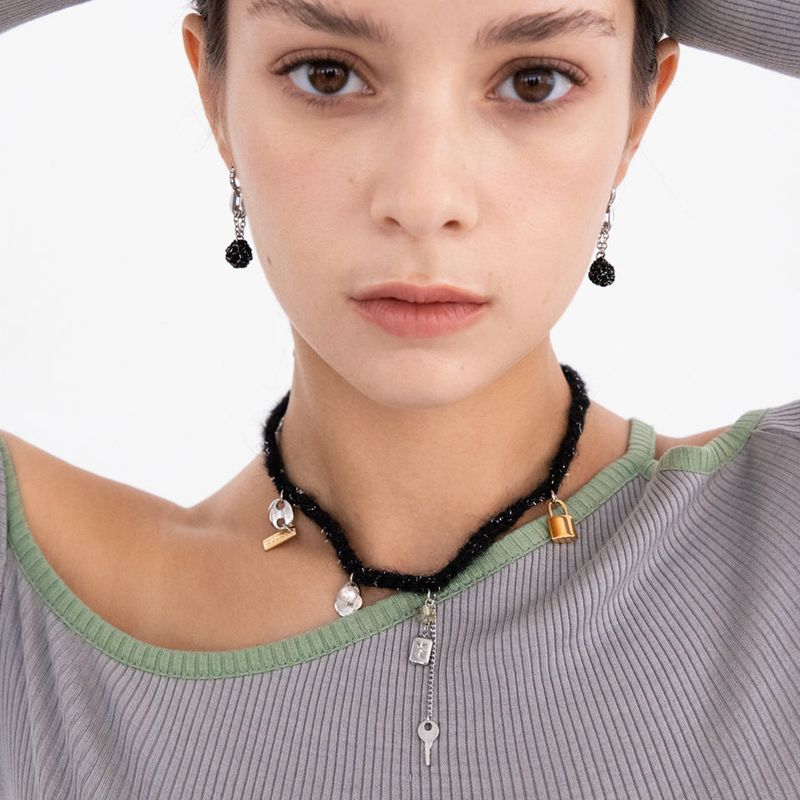 MerryMotive(メリーモチーブ)の「Wool black knit with unique objects necklace(Accessories)」