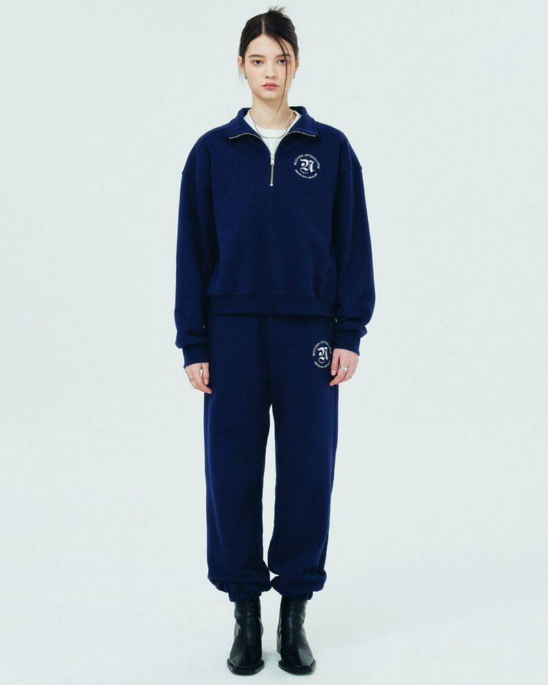NCOVER（エンカバー）の「ROMAN TYPO LOGO TRAINING PANTS-NAVY（Pants）」