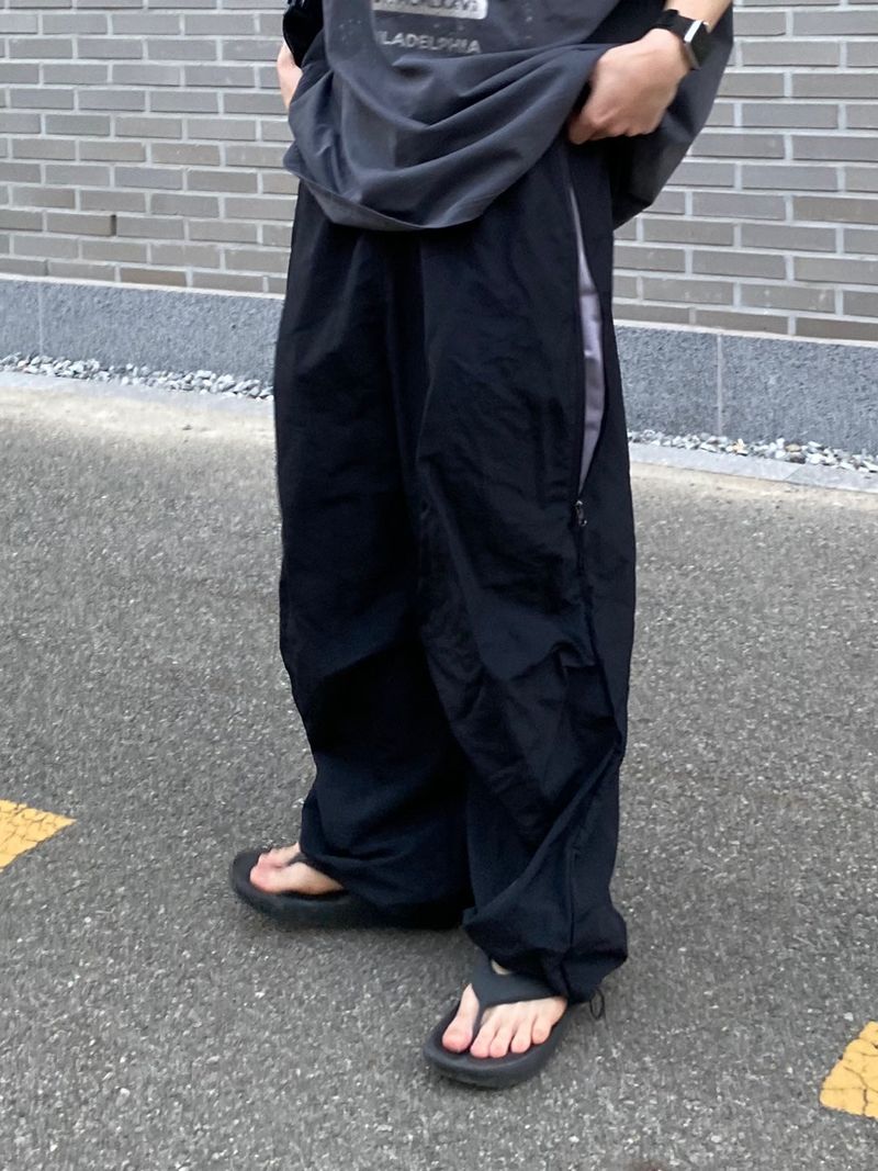 UNAIDUN（アネイダン）の「Coloration zipper nylon pants 2C（Pants）」