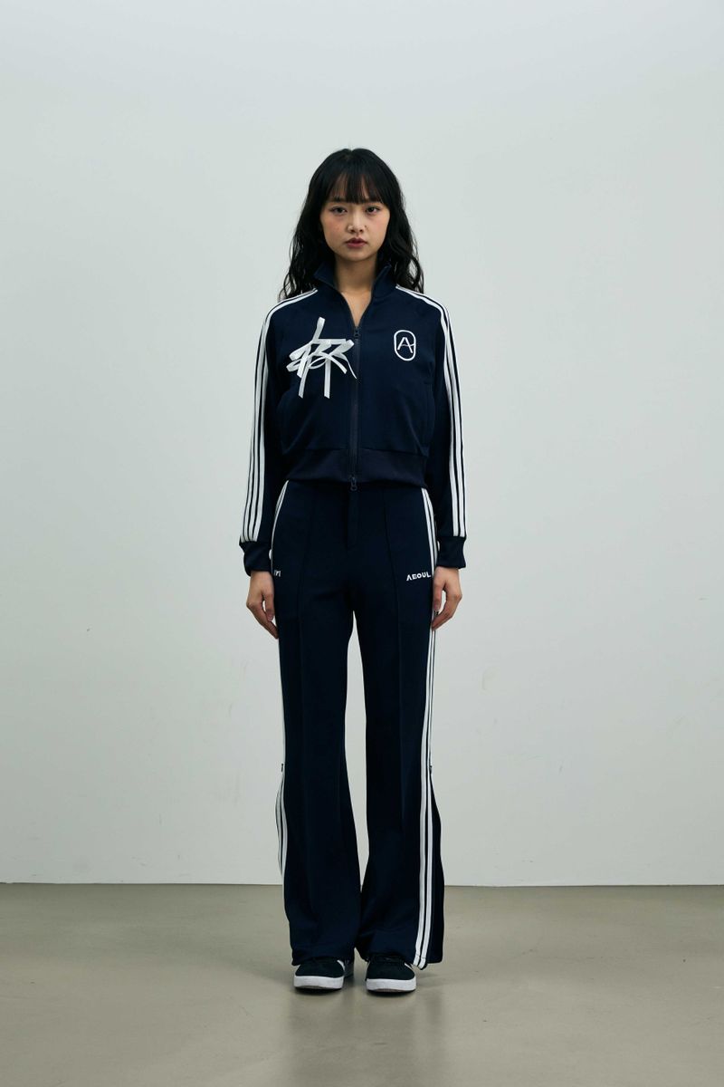 ARIKIM（アリキム）の「JOEL JERSEY TRACK TOP / NAVY（Tops）」