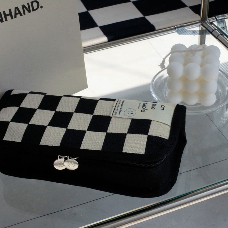 On the table pen case (checkerboard)