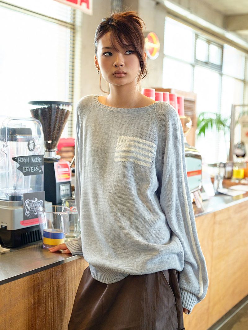 NYXX（エヌワイエックスエックス）の「FLAG BOATNECK KNIT LIGHT BLUE（Tops）」