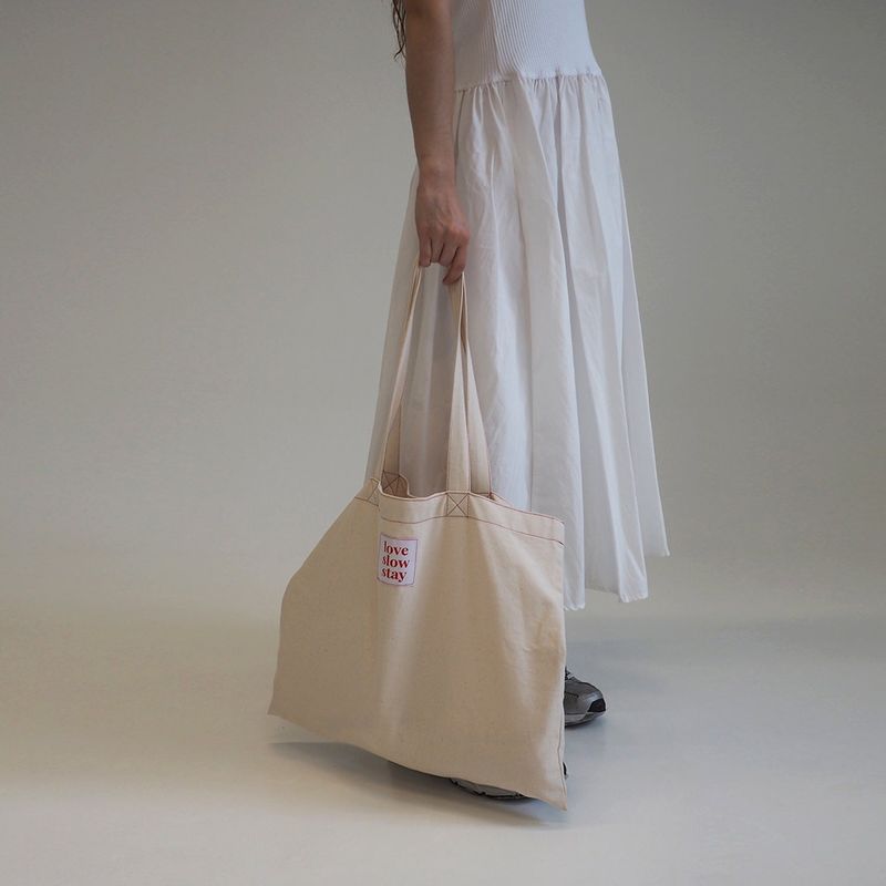 love slow stay（ラブ スロー ステイ）の「red stitch eco bag-ivory（Bags）」