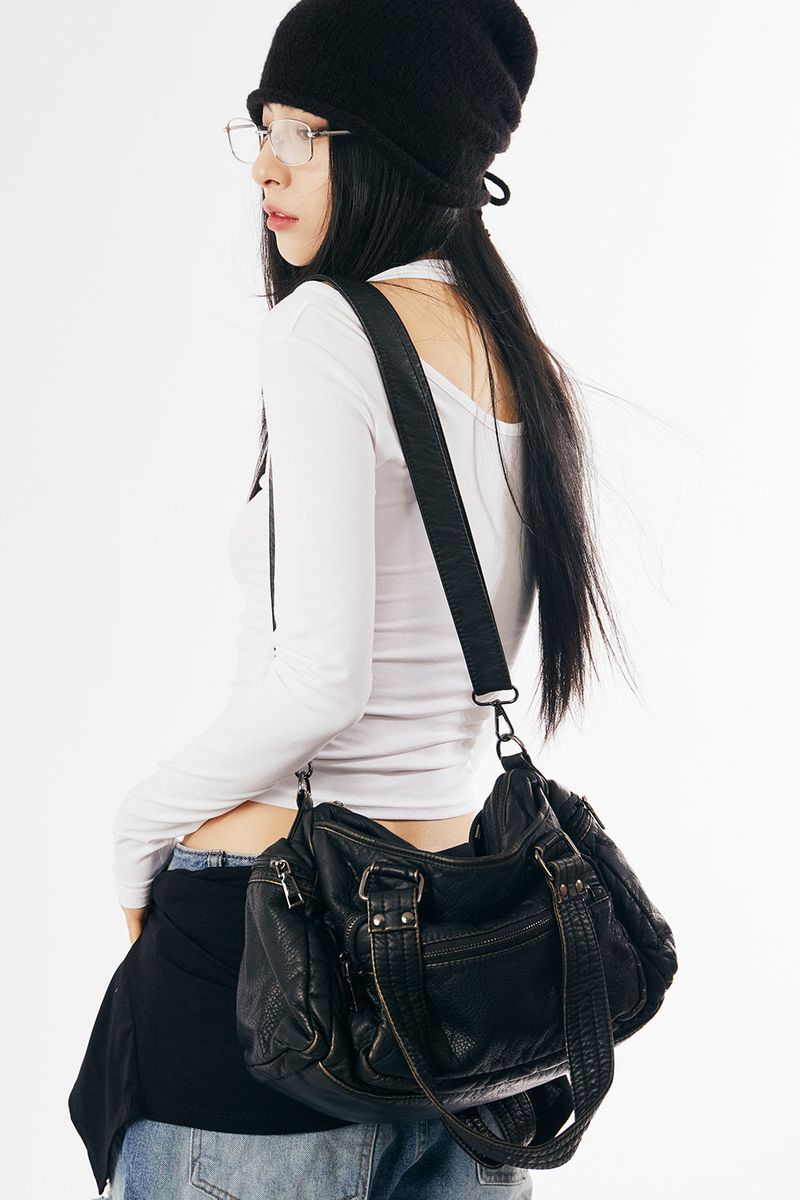 Old vintage multi-pocket leather bag
