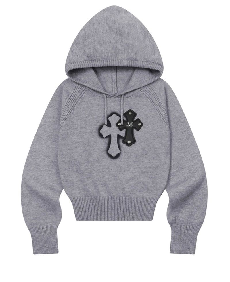 MUCENT（ムセント）の「KIAN SPRAY CROSS LEATHER PATCH KNIT HOOD T（Tops）」