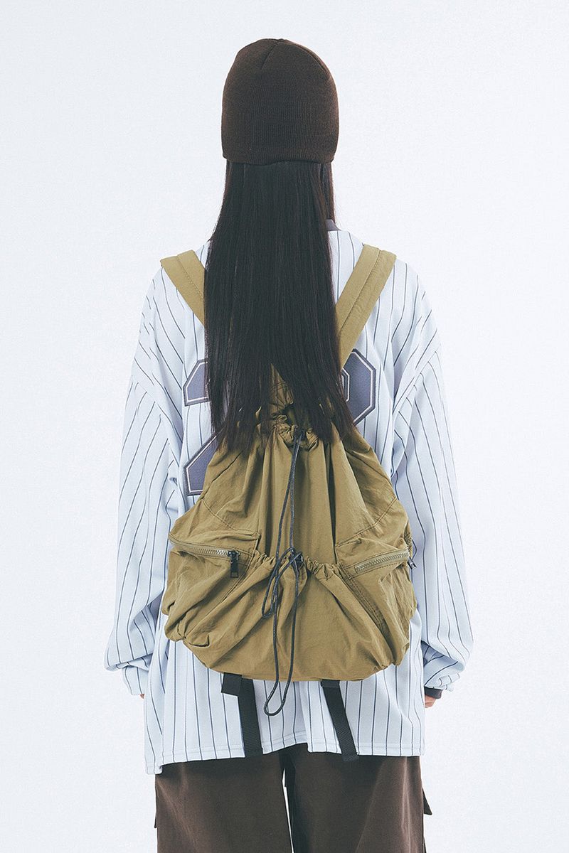 Raucohouse（ラウコハウス）の「Butter string multi-pocket backpack（Bags）」