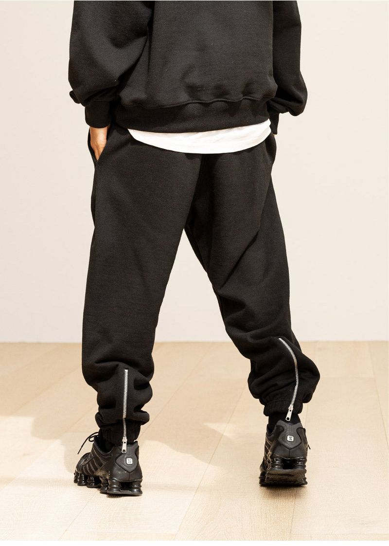 GRATING EMBLEM BACK SLIT ZIP PANTS