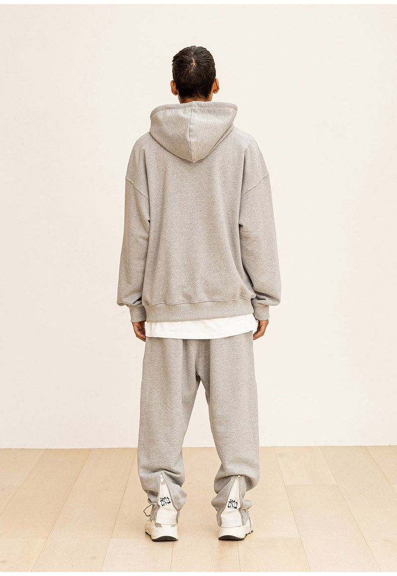 GRATING EMBLEM BACK SLIT ZIP PANTS