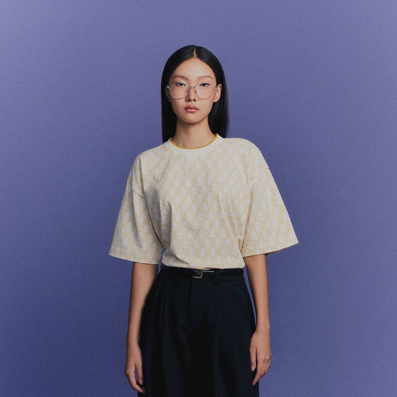 DVRK（ダーク）の「DVRKプライブモノグラムTシャツ - イエロー（トップス）」
