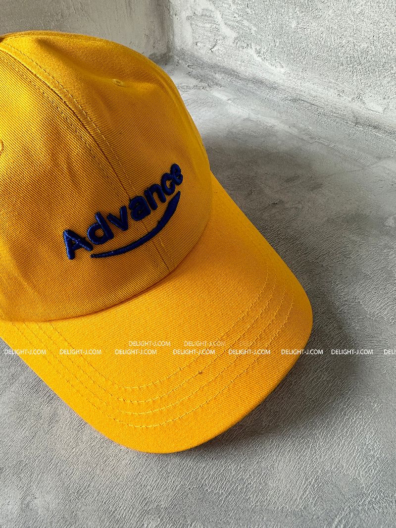 Yellow lettering ball cap