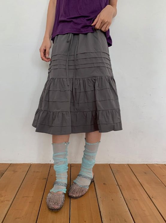 BAON（バオン）の「Haeya Pintuck Frill Tiered Midi Skirt（Skirts）」