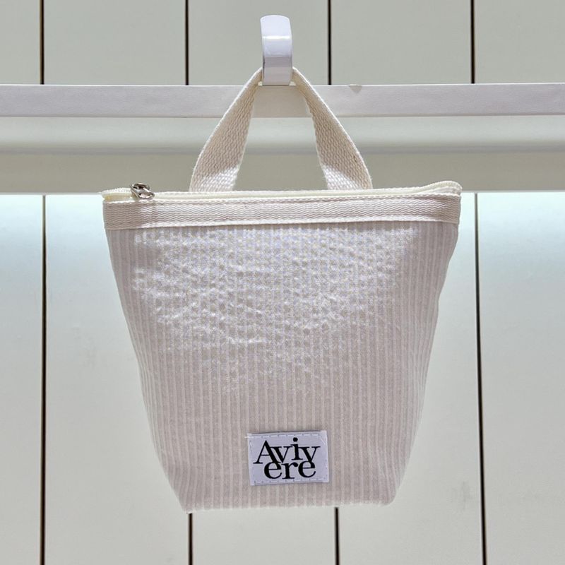 classic pouch_stripe handle ivory