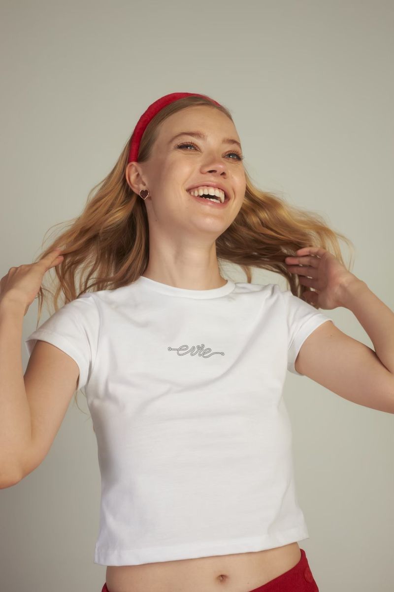 EVIE APPAREL（エヴィーアパレル）の「EVIE ベイビーTシャツ ホワイト（トップス）」
