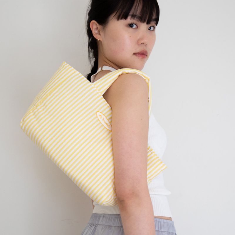 shytimothee（シャイティモシー）の「stripe padded bag - yellow（Bags）」