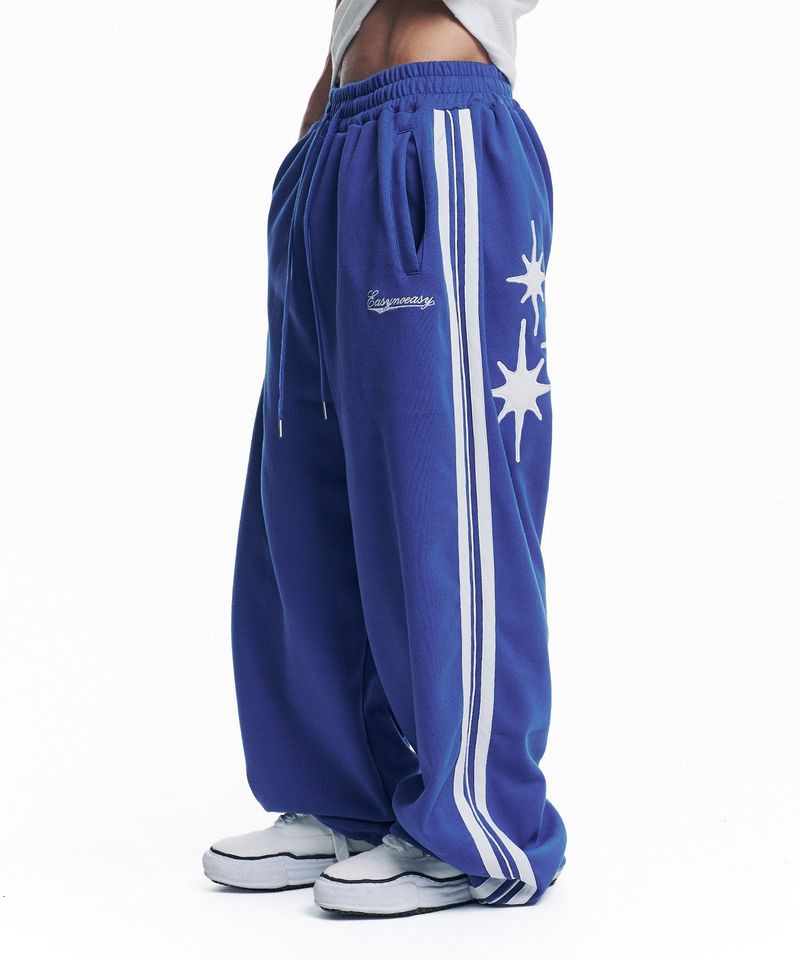 EASY NO EASY(イージーノーイージー)の「Star Piping Track Balloon Sweat Pants - Blue(Pants)」