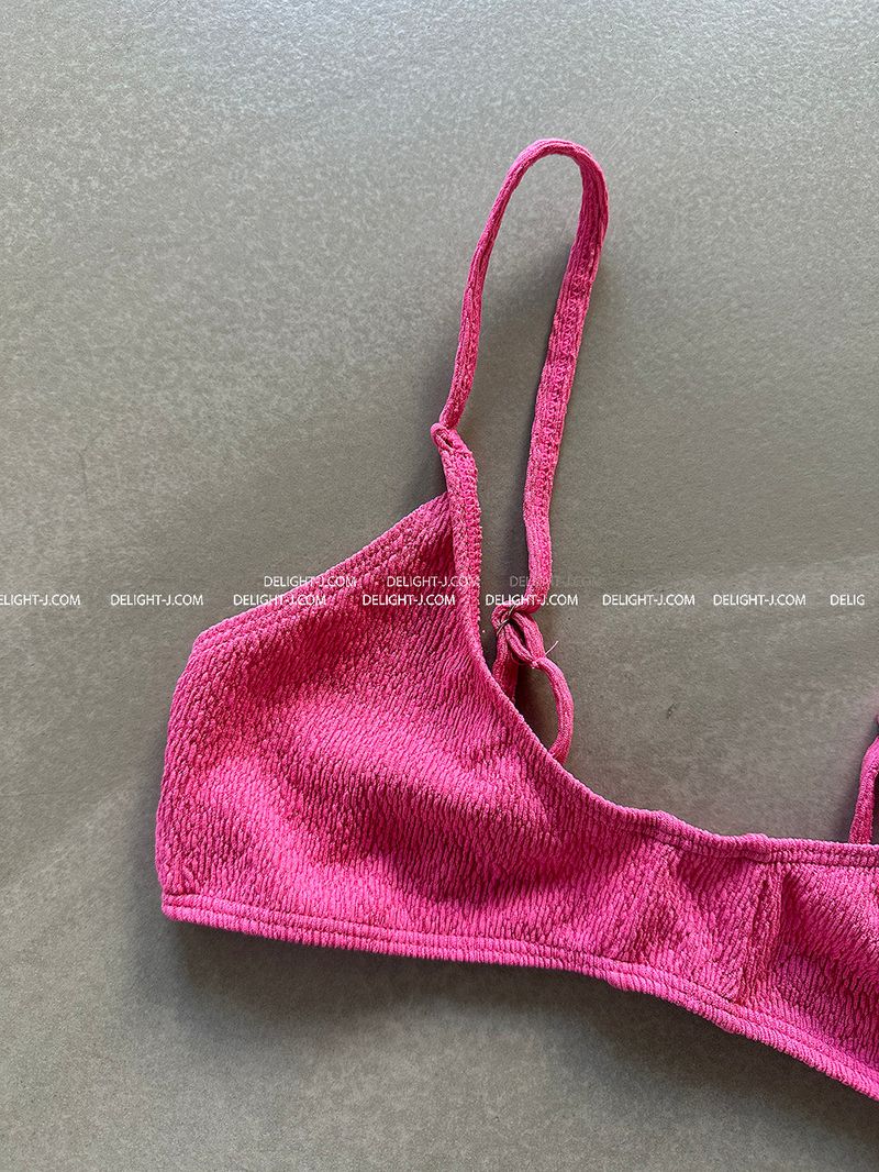 a set of 2 layered colored bikinis