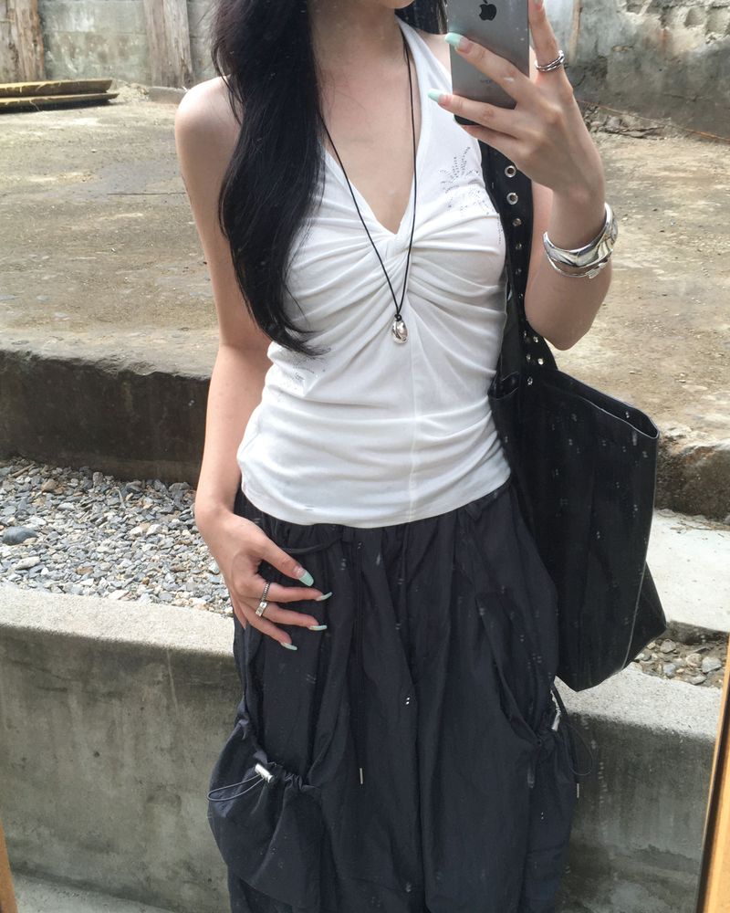 Cubic twisted sleeveless
