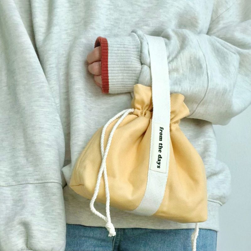 FROM THE DAYS(フロム ザ デイズ)の「【MADE】キャンバスポーチバッグ - マスタード(バッグ)」