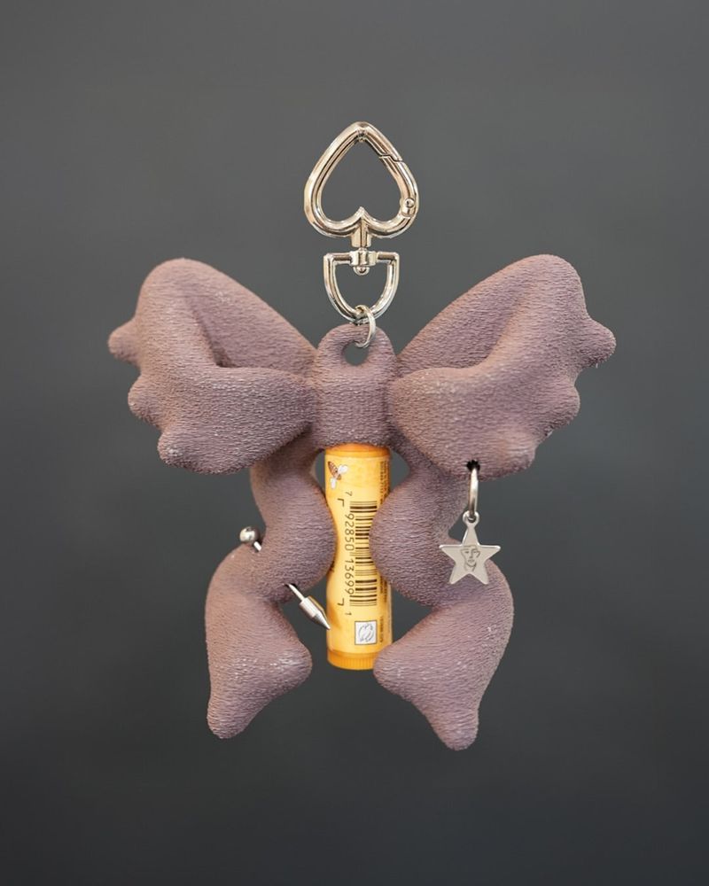 JIMI（ジミ）の「RIBBON BALM KEYCHAIN - Basilisk Purple（Toys/Key Holders）」