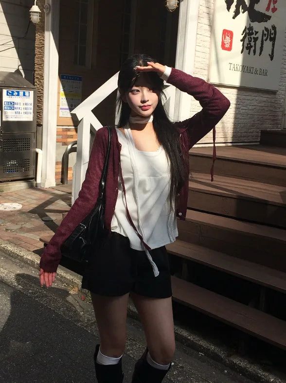 anyonemore（エニーワンモアー）の「Ryoki Strap Button Knit Cardigan（Tops）」