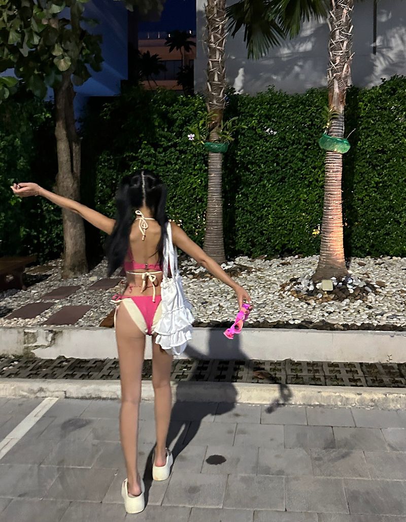 a set of 2 layered colored bikinis