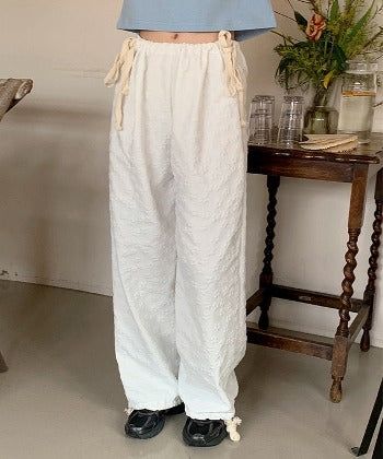 SHOPPERLAND(ショッパーランド)の「Flower Emboss String Wide Jogger Pants (4color)(Pants)」