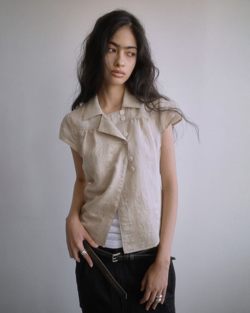 PORTERNA(ポルテナ)の「26SS★ WRAP BUTTON CAP SLEEVE BLOUSE(Tops)」