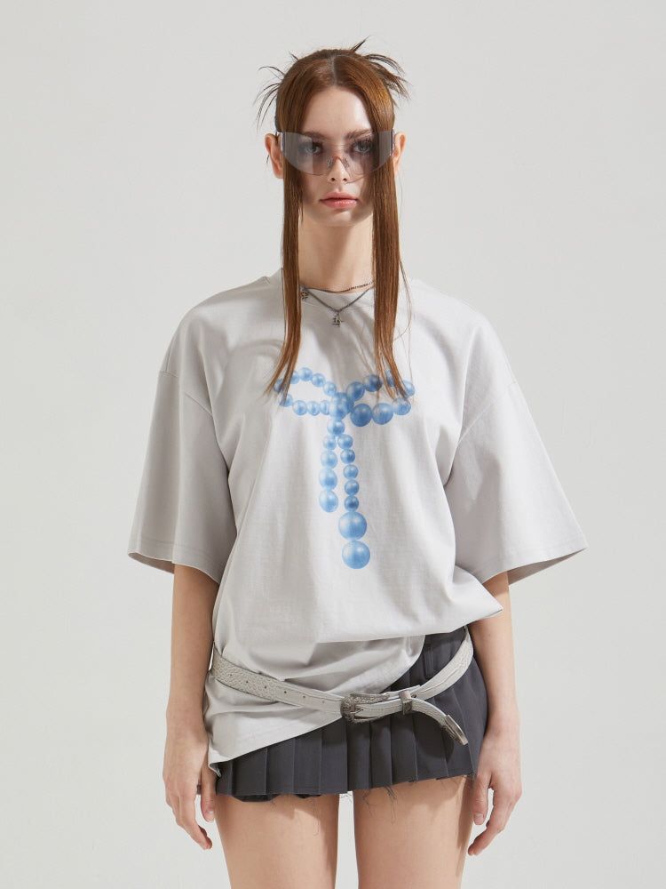 GATELESS（ゲートレス）の「ビーズリボンTシャツ（トップス）」