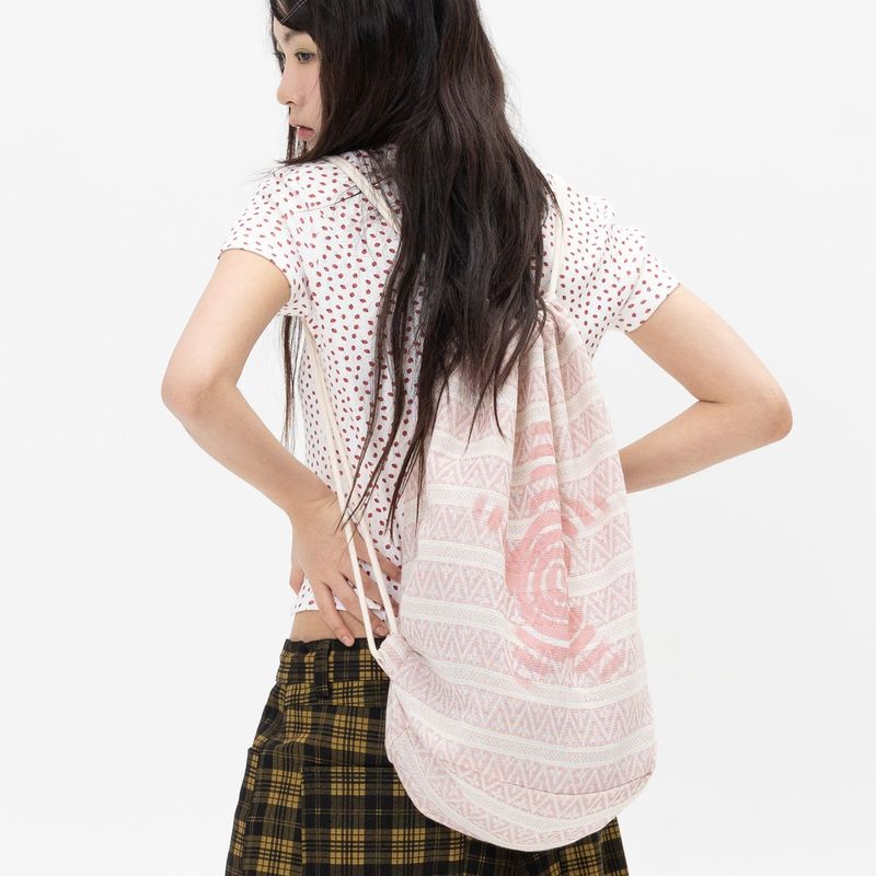 WEBHOUSE（ウェブハウス）の「Twister Ethnic String Bag - Pink（Bags）」