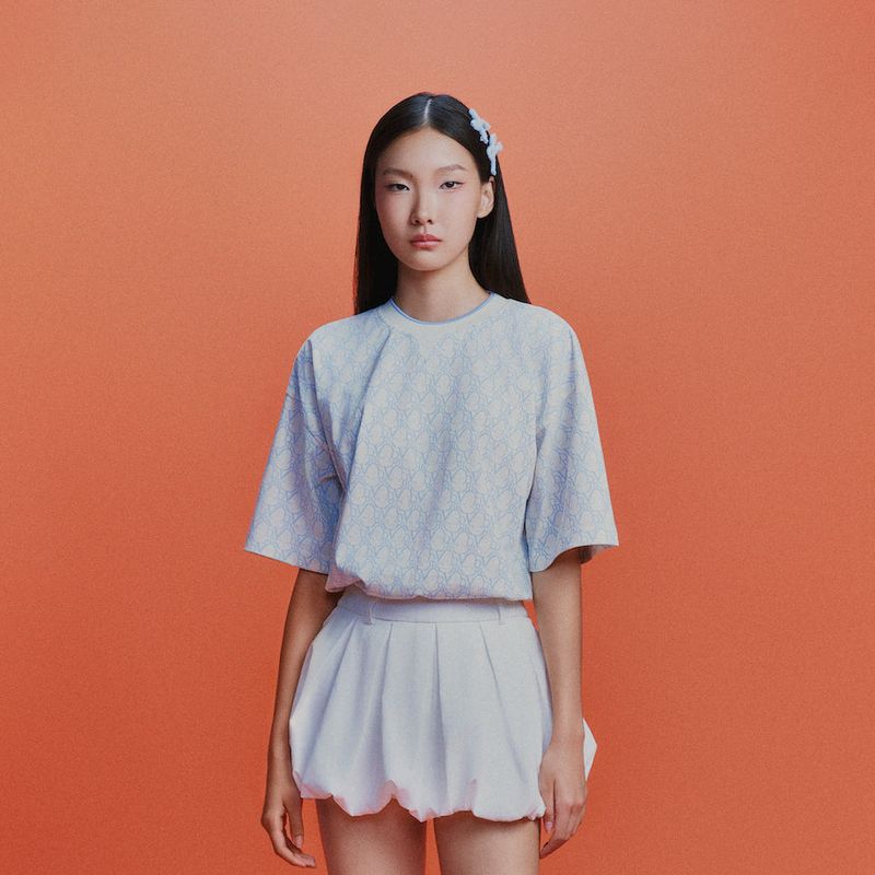 DVRK（ダーク）の「DVRK PRIVÉ MONOGRAM T-SHIRT - BABY BLUE（Tops）」