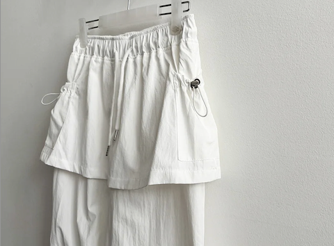 Log banding layered pocket skirt pants