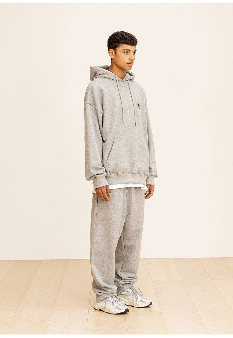 GRATING EMBLEM BACK SLIT ZIP PANTS
